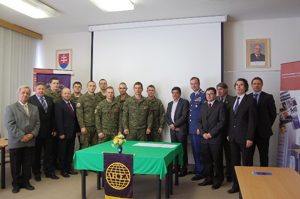 Together at the inaugural meeting of the new student club in April are (l-r) Col. Jozef Tulrajter (Ret.), head of the Department of Informatics, Armed Forces Academy (AFA); Col. Ladislav Kollarik (Ret.), vice president, Slovak Chapter; Petr Jirásek, regional vice president; several members of the new student club; Vladimr Ondrovič, president, Slovak Chapter; Brig. Gen. Boris Ďurkech, Air Force, vice rector for science and associate professor; Marcel Haraka, vice rector for science at the AFA and vice president of the Slovak Chapter; Lt. Col. Miroslav Ďulk, AFA, adviser to the student club; Col. Miroslav Lka (Ret.), professor and former rector at AFA; and Radoslav Majersk, general manager of CORINEX Group.